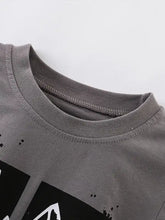 Gray cotton crew neck kids t-shirt with black white cartoon vehicle graphic