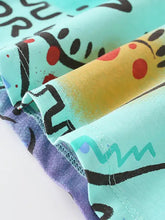 Dinosaur print crew neck t-shirt with teal abstract pattern, machine wash cold