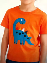 Bright orange kids dinosaur t-shirt with blue dinosaur applique