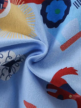 Light blue crew neck kids t-shirt with colorful floral print