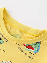 Yellow printed crew neck kids t-shirt with surfing crocodile and happiness comes in waves
