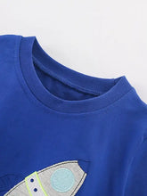 Blue rocket applique childrens t-shirt with exhaust trail, machine wash cold