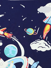 Children’s space adventure graphic navy t-shirt fabric with rockets, planets, clouds. Machine wash cold, tumble dry low