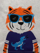 Children’s tiger graphic t-shirt with cartoon tiger in blue sunglasses. Machine wash cold, tumble dry low