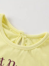 Back view of pale yellow unicorn graphic kids t-shirt with keyhole detail, machine wash cold