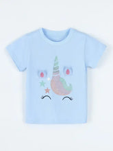 Light blue childrens unicorn t-shirt with glittery face, fabric ears. Machine wash cold