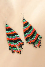 Festive Christmas beaded earrings with vibrant green, orange, black stripes