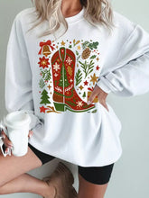 White corded rib drop shoulder sweatshirt with festive red green cowboy boot and holiday motifs, machine wash care instructions