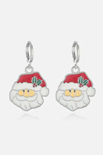 Silver Santa Claus Christmas theme alloy earrings with red hats and green holly leaves