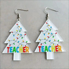 Christmas themed acrylic dangle earrings with white trees, lights, and Teacher letters