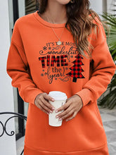 Orange long-sleeved drop shoulder sweatshirt with Christmas tree graphic