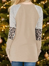 Tan long sleeve sweatshirt with christmas tree graphic and striped shoulders