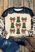 A festive cream Christmas tree sweatshirt with a slightly stretchy fabric and leopard bow sleeves and neckline
