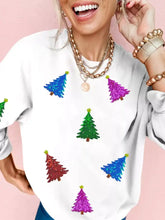 White festive sweatshirt with colorful sequined christmas tree patches in blue green red and purple machine wash safe