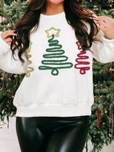 White christmas tree round neck sweatshirt with glittery green gold and red sequin designs and slightly stretchy material