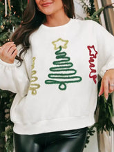 White christmas tree round neck sweatshirt with glittery green tree design and slightly stretchy sleeve length material