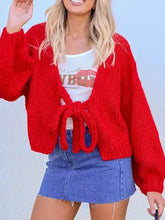 Chunky knit tie-front cardigan in red with earth tone hues