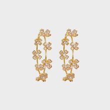 Circle shape rhinestone alloy earrings with gold-tone hoops and sparkling flower clusters