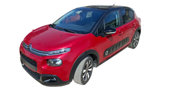 Red Citroën C3 hatchback with black roof and wheel arches, perfect choice with PureTech feel petrol engine