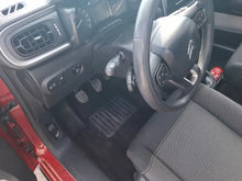 Citroen C3 1.2i PureTech Feel red car interior with steering wheel and pedals