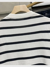Classic striped knit short sleeve T-shirt in black and white stripes with ribbed neckline