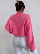Vibrant pink cloud button knit cardigan with ribbed cuffs, slightly stretchy