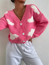 Pink slightly stretchy cloud button knit cardigan with white clouds