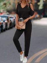 Black cold-shoulder jumpsuit with drawstring waist, machine wash cold