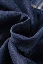 Dark blue denim dress with collared neck half zip detail featuring textured slightly worn denim fabric