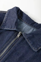 Dark blue denim dress with collared neck half zip and silver zipper featuring light-colored stitching detailing