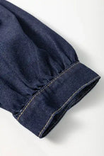 Dark blue denim dress sleeve with collared neck half zip featuring neatly stitched cuff and contrasting light thread