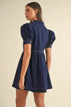 Navy blue denim dress with collared neck half zip and puffed short sleeves in a collared neck half zip denim dress style
