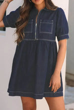 Navy blue denim dress with white stitching featuring a collared neck half zip detail in denim dress style