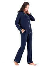 Navy blue collared neck long sleeve loungewear set with white piping and pockets showcasing sleeve length design