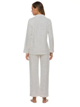 White collared neck loungewear set with long sleeve length and subtle black polka dot pattern featuring wide-leg pants