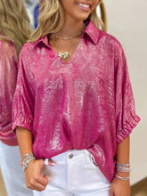 A shimmering fuchsia collared v neck half sleeve metallic blouse with a relaxed fit and three-quarter sleeves