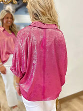 A shimmering fuchsia metallic collared v neck half sleeve top with puffed sleeves and relaxed fit in metallic fabric