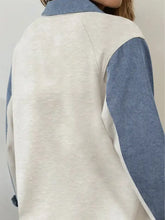 Color block button detail long sleeve top in soft heathered beige with denim blue sleeves and collar block button accents