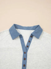 Color block button detail long sleeve top in light gray and blue denim-style with contrasting collar and button accents