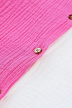 A vibrant pink textured cotton color block casual button up shirt with a subtle crinkle finish and metallic buttons