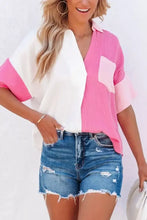 A vibrant pink and white color block casual button up shirt with relaxed fit short sleeves and chest pocket