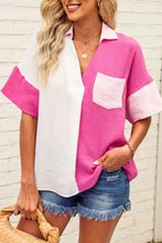 A vibrant two-tone pink and white color block casual button up shirt with textured fabric and contrasting pocket and sleeve details