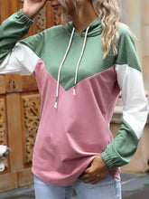 Color block casual long sleeve hoodie in sage green white and dusty pink with matching drawstrings made of slightly stretchy material