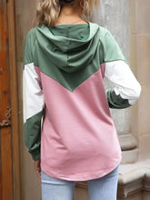 A cozy color block casual long sleeve hoodie in olive green white and soft pink made of slightly stretchy material
