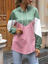 Color block casual long sleeve hoodie in mint green white and pink made of slightly stretchy material with drawstring hood