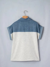 Short sleeve color block denim patchwork polo shirt with denim blue upper and heathered off-white lower body