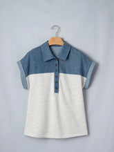 A denim patchwork short sleeve polo shirt with color block denim collar, cuffs, and button placket in heather white