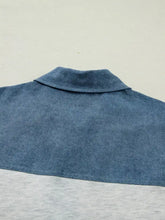 Blue denim patchwork short sleeve polo shirt with classic collar and contrasting gray color block denim lower section