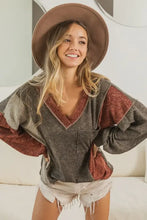 Color block exposed seam V neck top in brown, gray with maroon accents