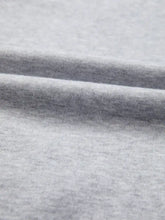 Heather gray cotton color block flower embroidered patch graphic raglan long sleeve top features soft textured knit